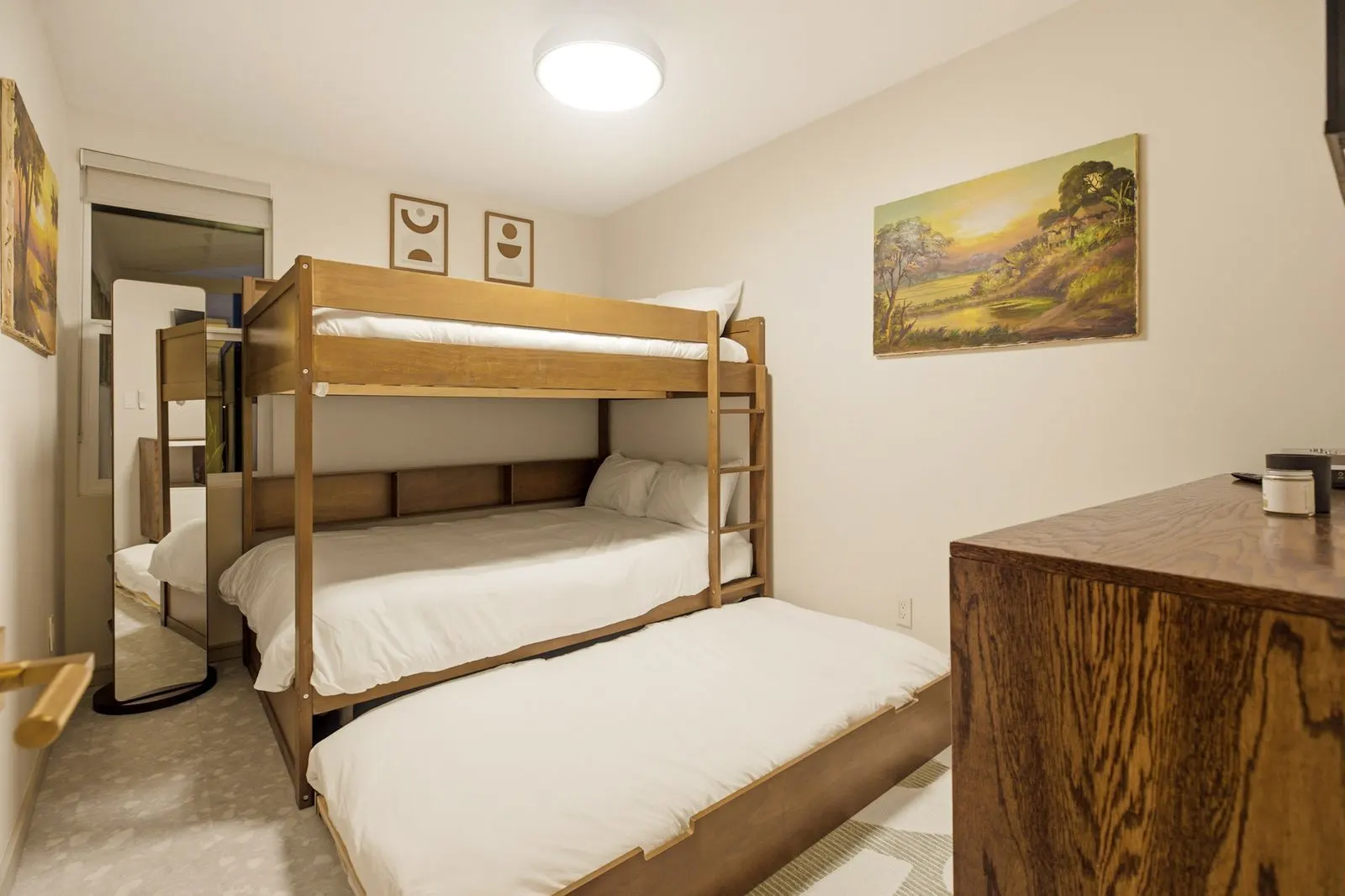 Wood bunk bed with a pull-out trundle